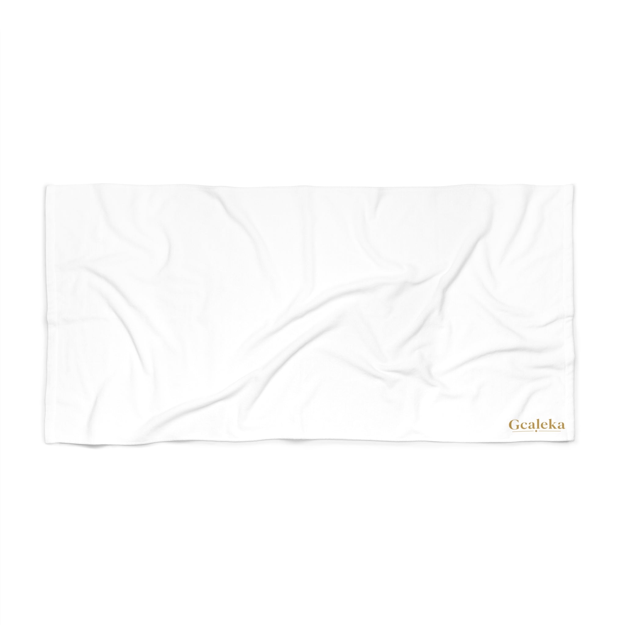 White Beach Towel with Small Gold 'Gcaleka' Logo — Minimal Luxury Pool & Resort Towel