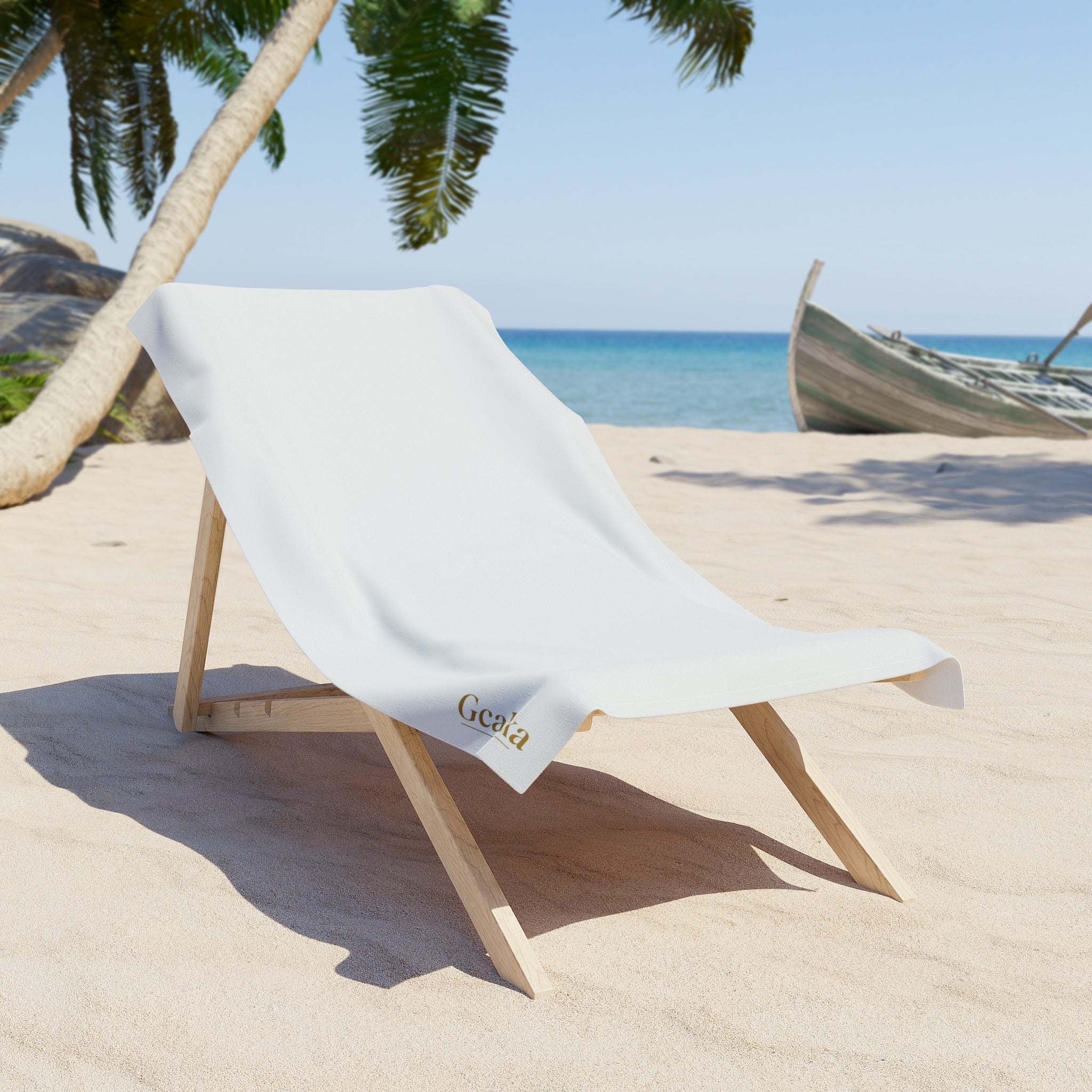 White Beach Towel with Small Gold 'Gcaleka' Logo — Minimal Luxury Pool & Resort Towel