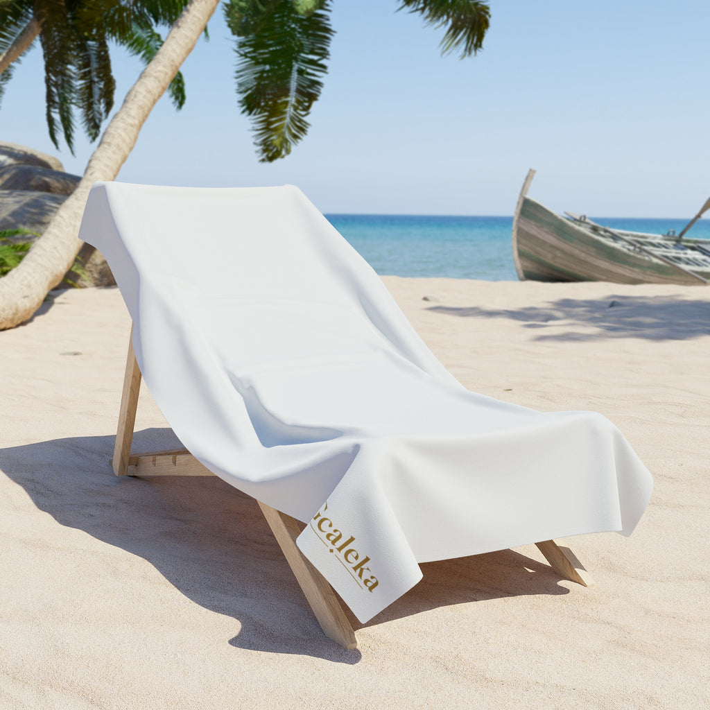 White Beach Towel with Small Gold 'Gcaleka' Logo — Minimal Luxury Pool & Resort Towel
