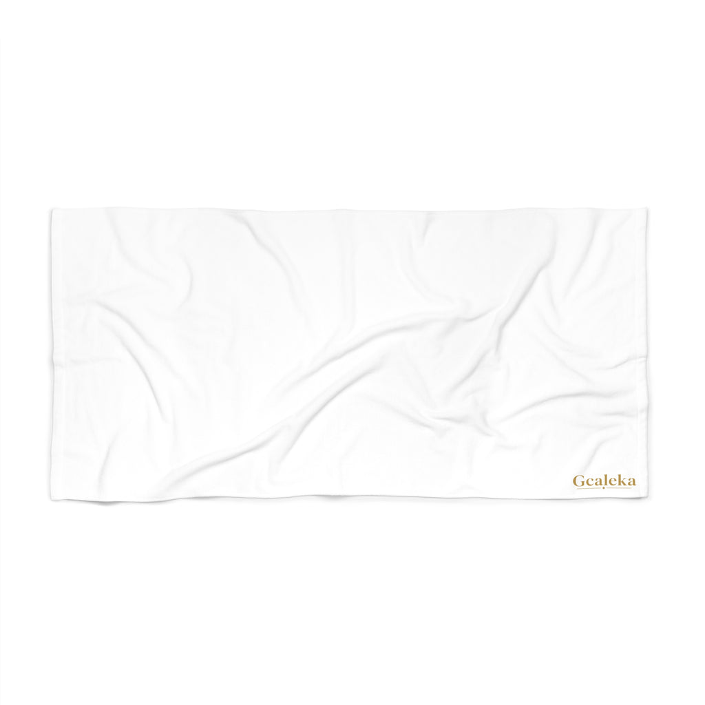 White Beach Towel with Small Gold 'Gcaleka' Logo — Minimal Luxury Pool & Resort Towel